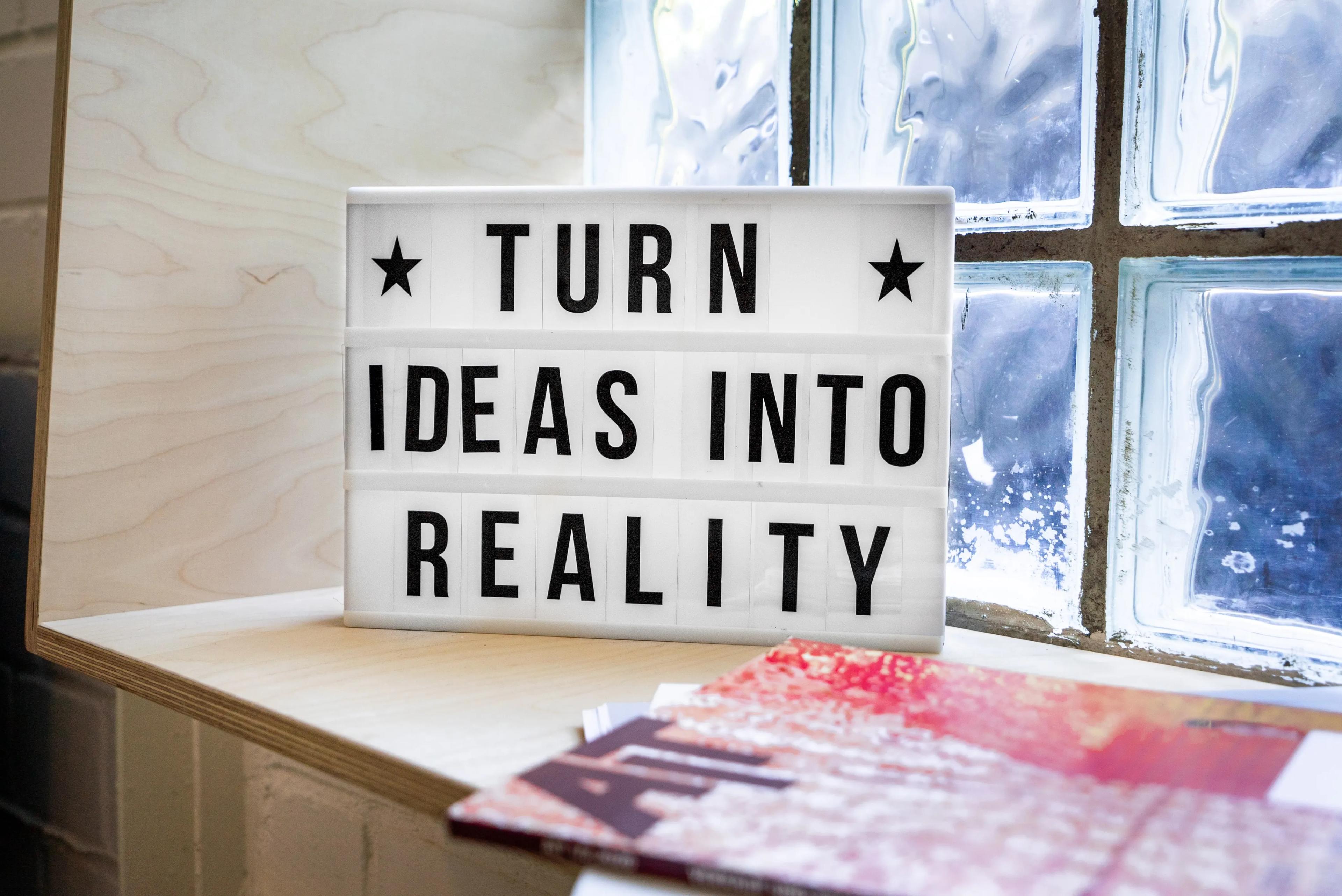 A sign reading "turn ideas into reality"